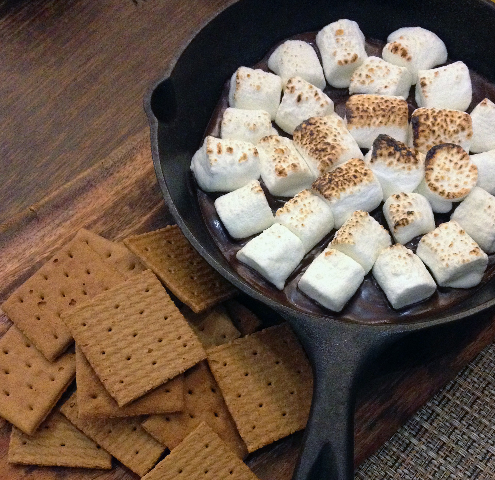 Marshmallows in frying pan and graham crackers for smores